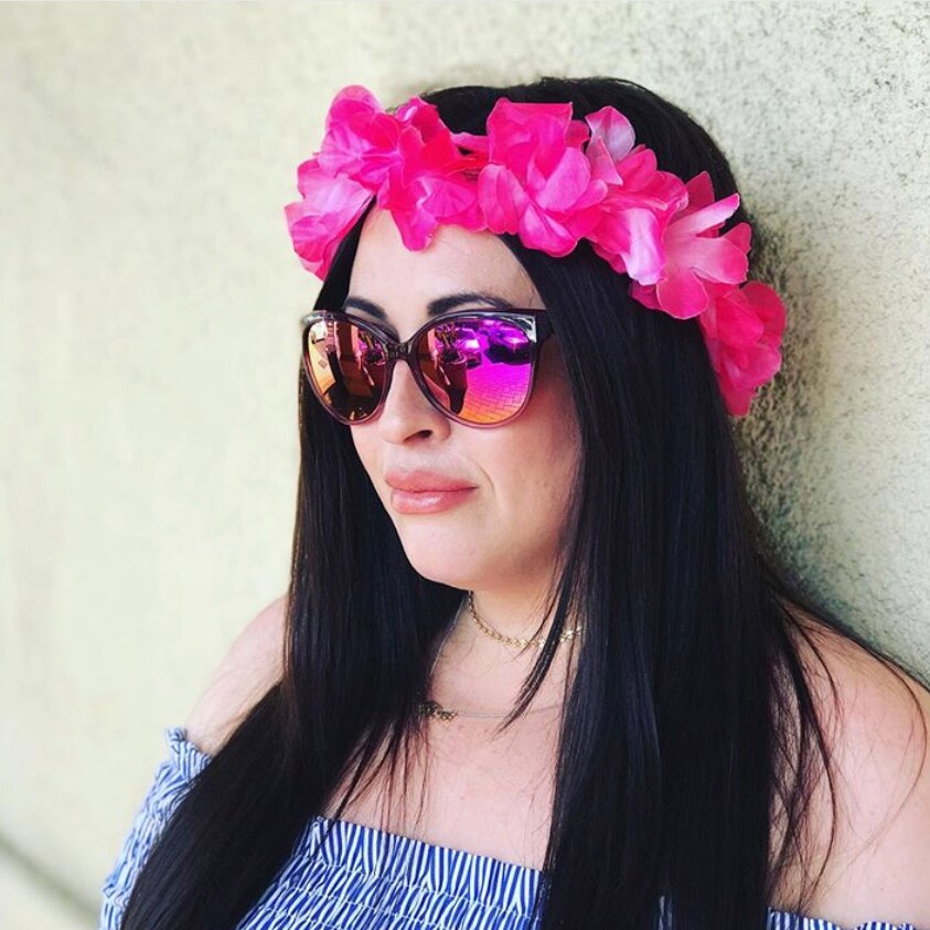 Girl in 'Olu 'Olu glasses with pink lei around head