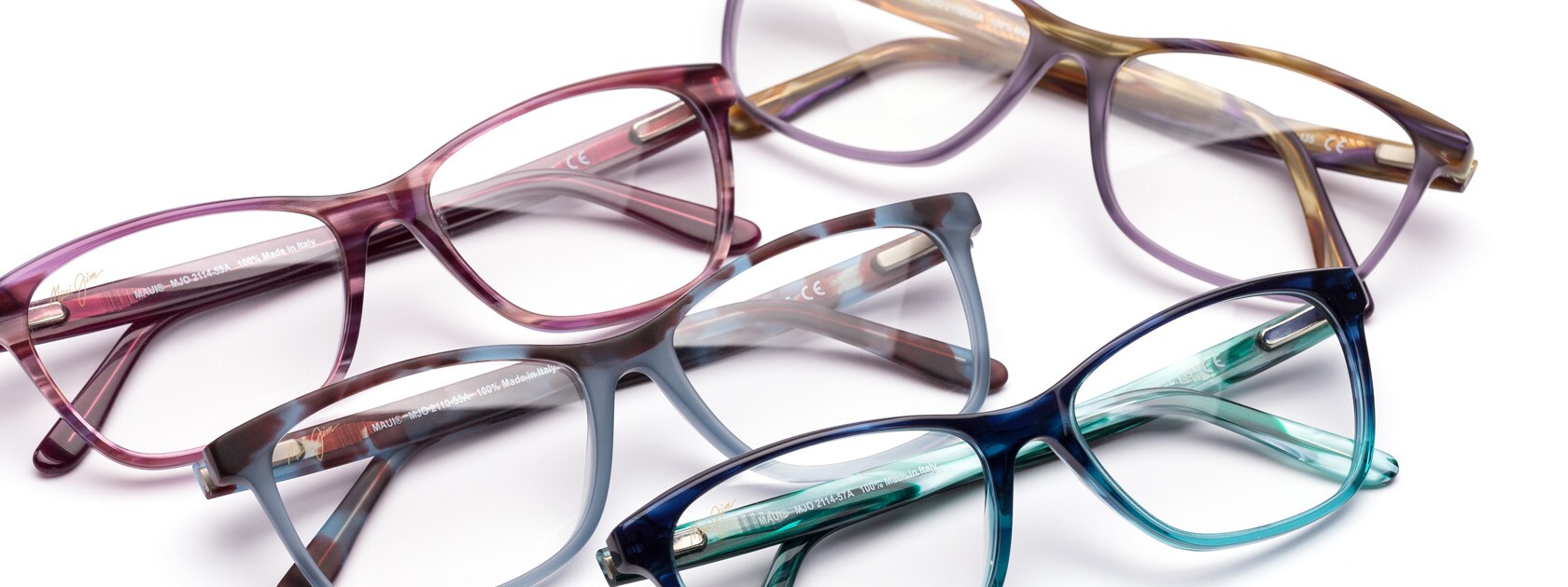 four pairs of ophthalmic glasses displayed over white background